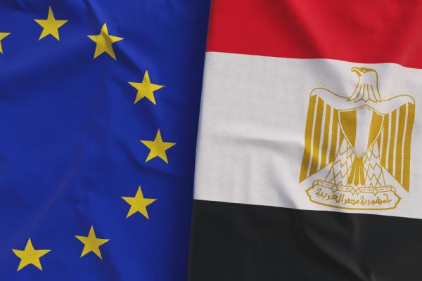 Two flags are shown side by side: on the left, the flag of the EU, on the right, the flag of Egypt.